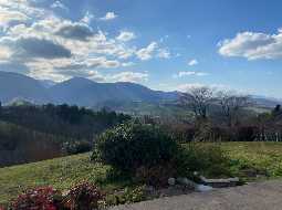 Contemporary property with magnificent mountain views in tranquil setting close to a village 